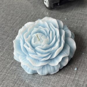 shaded peony flower candle in blue